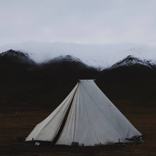 white canvas tent in field 