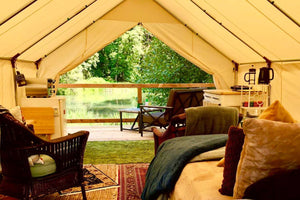 wall tent with glamping furniture in it