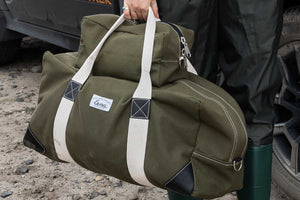 canvas duffel bag being held in hand