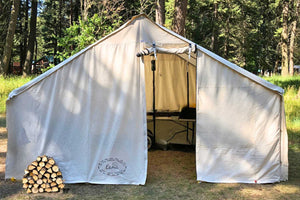 beckel wall tent with wood in front 