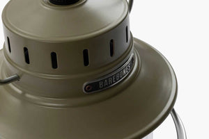 barebones logo on top of green camping lantern